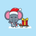 Cute elephant carrying christmas gift box. Cute christmas cartoon character illustration. Royalty Free Stock Photo