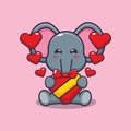 Cute elephant happy with love gift in valentine\'s day. Royalty Free Stock Photo