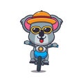 Cool koala with sunglasses riding a motorcycle in summer day.