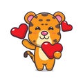 Cute leopard cartoon character holding love heart at valentine\'s day. Royalty Free Stock Photo
