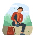 Man Sitting for Tie Shoelaces While Living in Public Park Royalty Free Stock Photo