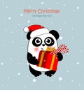Christmas panda in Santa hat with  present and candies. Funny animal character for your design. Royalty Free Stock Photo
