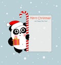 Christmas panda with letter to Santa ,candy and present. Funny animal character for your design. Royalty Free Stock Photo