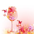 Elegant wine glass with flowers. Floral aroma wine in goblet. Colorful stemware with alcoholic beverage for celebrations. Floral w Royalty Free Stock Photo