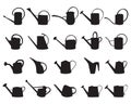 Black silhouettes of watering cans