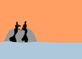 Two mermaid silhouettes sitting on the rocks