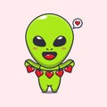 Cute alien holding love decoration cartoon vector Illustration. Royalty Free Stock Photo