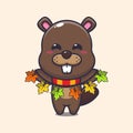 Cute beaver with autumn leaf decoration.