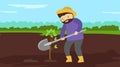 A man with a shovel digs a hole in the ground. Royalty Free Stock Photo