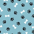 Cute seamless pattern with pet paw and bone. Royalty Free Stock Photo
