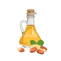 Peanut oil in glass bottle and heap of nuts isolated on white.