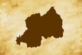 Brown map of Country Rwanda isolated on old paper grunge texture background - vector Royalty Free Stock Photo