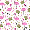 Christmas flamingo seamless pattern. Funny flamingos in Santa\'s hat. Gift box and candy cane