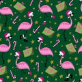 Christmas flamingo seamless pattern. Funny flamingos in Santa\'s hat. Gift box and candy cane.