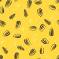 Sunflower seeds on yellow seamless pattern. Vector food background. Royalty Free Stock Photo