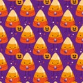 Candy corn seamless pattern - cute smiley candy corn with pumpkin on purple background