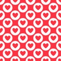 red heart shape inside a white circle repeat pattern on a red background