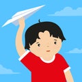 Cute little boy playing with paper plane in the sky. Royalty Free Stock Photo