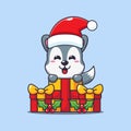 Cute wolf happy with christmas gift. Cute christmas cartoon character illustration.