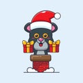 Cute panther with santa hat in the chimney. Cute christmas cartoon character illustration. Royalty Free Stock Photo