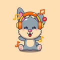 Cute rabbit listening music with headphone cartoon vector illustration. Royalty Free Stock Photo