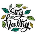 Stay healthy. Hand drawn lettering with leaves.