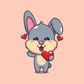 Cute rabbit cartoon character holding love heart at valentine\'s day. Royalty Free Stock Photo