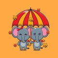 Cute couple elephant with umbrella at autumn season. Royalty Free Stock Photo