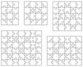 Separate parts of five white puzzles Royalty Free Stock Photo