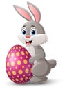 Cute little bunny with easter egg on white background Royalty Free Stock Photo