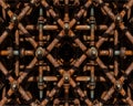 Intricate rusted metal pipework grid with diamond pattern Royalty Free Stock Photo