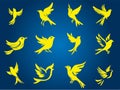 Yellow bird silhouettes in various flight poses are scattered across a gradient blue background Royalty Free Stock Photo
