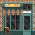 Classic coffee shop facade featuring a brick exterior. Royalty Free Stock Photo