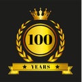 Golden emblem celebrating 100 years features a laurel wreath encircling the number \
