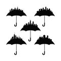 Silhouettes City skylines protected by umbrellas, urban safety concept Royalty Free Stock Photo