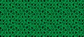 Seamless pattern featuring an assortment of black triangles on a vibrant green background Royalty Free Stock Photo