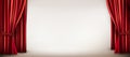 Red curtains parted to reveal a plain white background setting evokes a theater stage or presentation area,. Royalty Free Stock Photo