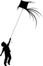 Child flying a kite silhouette Royalty Free Stock Photo