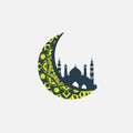 Crescent moon with intricate yellow patterns encircles a silhouette of an Islamic mosque Royalty Free Stock Photo