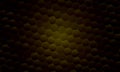 Dark yellow hexagonal honeycomb abstract pattern background. soft central spotlight effect. Royalty Free Stock Photo