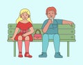 A couple of young people, a man and a woman are sitting on a bench. Royalty Free Stock Photo