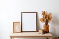 Print frame autumn mockup on shelf in living room