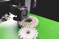 print head, bright green print bed and white helical gears with visible infill and layer. opblique view on process of 3D-printing Royalty Free Stock Photo