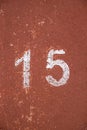 Stencil number fifteen on a red background Royalty Free Stock Photo