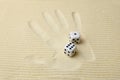 Print of a palm with dices lying on it Royalty Free Stock Photo