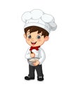 Cute little boy chef cook mixing ingredients in bowl Royalty Free Stock Photo