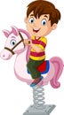 Cute little boy riding rocking horse Royalty Free Stock Photo