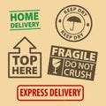 Set of fragile sticker Do not crush and case icon packaging symbols sign, fragile and Keep Dry rubber stamp on cardboard backgroun Royalty Free Stock Photo