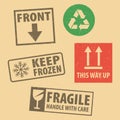 Set of fragile sticker handle with care and case icon packaging symbols sign, keep frozen and this side up rubber stamp on cardboa Royalty Free Stock Photo