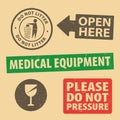 Set of fragile sticker Medical Equipment icon packaging symbols sign, Do Not Pressure, Open Here rubber stamp on cardboard backgro Royalty Free Stock Photo